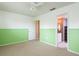 Bright bedroom with ceiling fan and access to bathroom at 6325 Newtown Cir # 25B2, Tampa, FL 33615