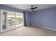 Bedroom with water view and sliding door to balcony at 6325 Newtown Cir # 25B2, Tampa, FL 33615