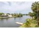 Peaceful canal view with private dock and lush tropical landscaping at 6325 Newtown Cir # 25B2, Tampa, FL 33615