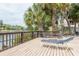 Relaxing waterfront deck with lounge chairs, overlooking a peaceful canal at 6325 Newtown Cir # 25B2, Tampa, FL 33615