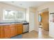 Cozy kitchen with wood cabinets and stainless steel appliances at 6325 Newtown Cir # 25B2, Tampa, FL 33615