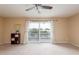 Spacious living room featuring a view and sliding doors to a balcony at 6325 Newtown Cir # 25B2, Tampa, FL 33615