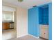 Living room with wet bar and view to kitchen at 6325 Newtown Cir # 25B2, Tampa, FL 33615