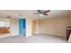 Living room with kitchen and hallway access at 6325 Newtown Cir # 25B2, Tampa, FL 33615