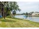Scenic waterfront view with lush greenery and boat access at 6325 Newtown Cir # 25B2, Tampa, FL 33615