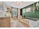 Charming bedroom with green accent wall and playful decor at 6531 Kenava Loop, Palmetto, FL 34221