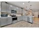 Modern kitchen with stainless steel appliances and gray cabinets at 6531 Kenava Loop, Palmetto, FL 34221