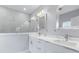 Bathroom with a double vanity, marble countertops, glass shower, and modern fixtures at 6605 24Th S Ave, Tampa, FL 33619