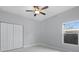 Spacious bedroom with window and ceiling fan at 6605 24Th S Ave, Tampa, FL 33619
