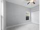 Bright bedroom featuring a ceiling fan and large closet at 6605 24Th S Ave, Tampa, FL 33619