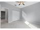 Bright bedroom with ceiling fan and large closet at 6605 24Th S Ave, Tampa, FL 33619