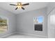 Spacious bedroom with two windows and ceiling fan at 6605 24Th S Ave, Tampa, FL 33619