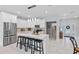 Bright modern kitchen features a center island with bar stool seating and state of the art appliances at 6605 24Th S Ave, Tampa, FL 33619