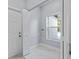 Laundry room with built-in shelving and marble flooring at 6605 24Th S Ave, Tampa, FL 33619