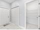 Bright laundry room with built-in shelving and marble flooring at 6605 24Th S Ave, Tampa, FL 33619