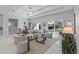 Bright and airy living room with marble floors, recessed lighting, and a seamless flow to the dining area at 6605 24Th S Ave, Tampa, FL 33619
