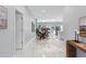 Open-concept living space with modern lighting, marble floors, and an open dining and living room concept at 6605 24Th S Ave, Tampa, FL 33619