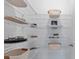 Organized walk-in pantry with wire shelving, baskets, and ample storage space at 6605 24Th S Ave, Tampa, FL 33619