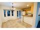 Kitchen features an eat-in area, a breakfast bar, and French doors to outside at 7117 50Th E Ave, Palmetto, FL 34221