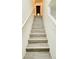 Modern staircase with grey laminate wood steps at 7117 50Th E Ave, Palmetto, FL 34221