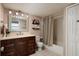 Clean bathroom with updated vanity and shower/tub combo at 7700 Sun Island S Dr # 702, South Pasadena, FL 33707