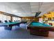 Community game room with multiple billiard tables at 7700 Sun Island S Dr # 702, South Pasadena, FL 33707