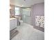 Bathroom with walk-in shower, toilet and white vanity at 940 Virginia St # 208, Dunedin, FL 34698