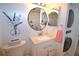 Updated bathroom with white vanity, walk-in shower, and modern fixtures at 940 Virginia St # 208, Dunedin, FL 34698