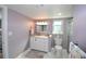 Spacious bathroom with a white vanity and a separate shower and toilet area at 940 Virginia St # 208, Dunedin, FL 34698
