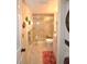 Clean bathroom with a large walk-in shower and tile flooring at 940 Virginia St # 208, Dunedin, FL 34698