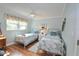Guest bedroom with twin beds and coastal decor at 940 Virginia St # 208, Dunedin, FL 34698