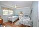 Guest bedroom with twin beds and coastal decor at 940 Virginia St # 208, Dunedin, FL 34698