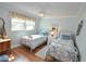 Guest bedroom with twin beds and coastal decor at 940 Virginia St # 208, Dunedin, FL 34698
