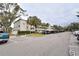 Condo building with covered parking and guest parking at 940 Virginia St # 208, Dunedin, FL 34698