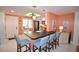 Updated kitchen with breakfast bar and light-colored cabinets at 940 Virginia St # 208, Dunedin, FL 34698