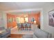 Open concept kitchen with breakfast bar and view to living room at 940 Virginia St # 208, Dunedin, FL 34698