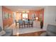 Open concept kitchen with breakfast bar and view to living room at 940 Virginia St # 208, Dunedin, FL 34698