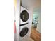 Convenient laundry closet with stacked washer and dryer at 940 Virginia St # 208, Dunedin, FL 34698