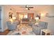 Living room with comfortable seating and area rug at 940 Virginia St # 208, Dunedin, FL 34698