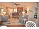 Bright living room with comfy seating and view to kitchen at 940 Virginia St # 208, Dunedin, FL 34698
