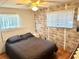 Main bedroom with double bed and wood floors at 9790 66Th N St # 33, Pinellas Park, FL 33782