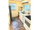Galley kitchen with electric stove and refrigerator at 9790 66Th N St # 33, Pinellas Park, FL 33782