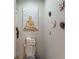 Small bathroom with toilet and decorative wall art at 993 Anchor Bend Dr, Ruskin, FL 33570