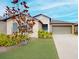 One-story house with gray shutters and a two-car garage at 993 Anchor Bend Dr, Ruskin, FL 33570
