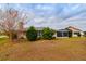 Backyard with lush landscaping and screened patio at 1015 El Rancho Dr, Sun City Center, FL 33573