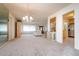 Bright dining room with chandelier and view into living room at 1015 El Rancho Dr, Sun City Center, FL 33573