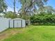 Backyard with shed and grassy lawn at 10603 Coquita Ln, Tampa, FL 33618