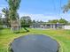 Large backyard with trampoline and pool view at 10603 Coquita Ln, Tampa, FL 33618
