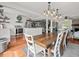 Open concept dining room with farmhouse table and kitchen view at 10603 Coquita Ln, Tampa, FL 33618
