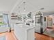 Island kitchen with white cabinets and marble countertops at 10603 Coquita Ln, Tampa, FL 33618